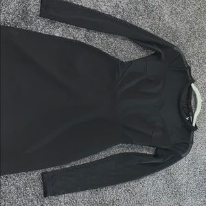 Black dress with mesh cut outs on sleeve and belly